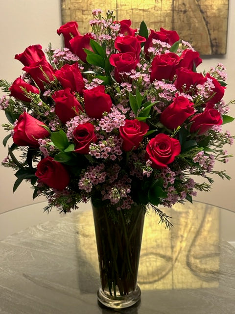24 stem red roses and pink wax flowers